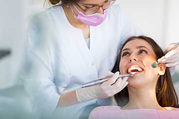 Dental Hygienist cleaning teeth